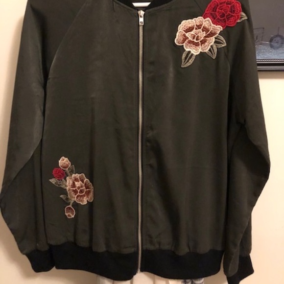 green jacket with flowers